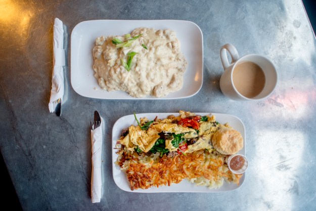 1. Signs for Gil's Goods, The Murray Bar and the Murray Hotel line West Park Street in Livingston. / 2. A plate of biscuits, gravy, veggie eggs and hash browns at Gil’s Goods.