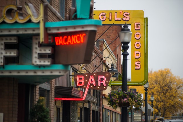 1. Signs for Gil's Goods, The Murray Bar and the Murray Hotel line West Park Street in Livingston. / 2. A plate of biscuits, gravy, veggie eggs and hash browns at Gil’s Goods.