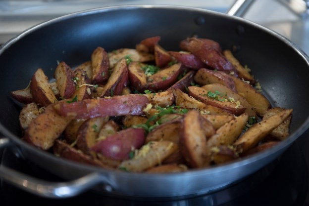 1. Lemon and parsley roasted red potatoes is seen at Westside Bistro. / 2. Kahlua pork and cabbage is seen at Westside Bistro.