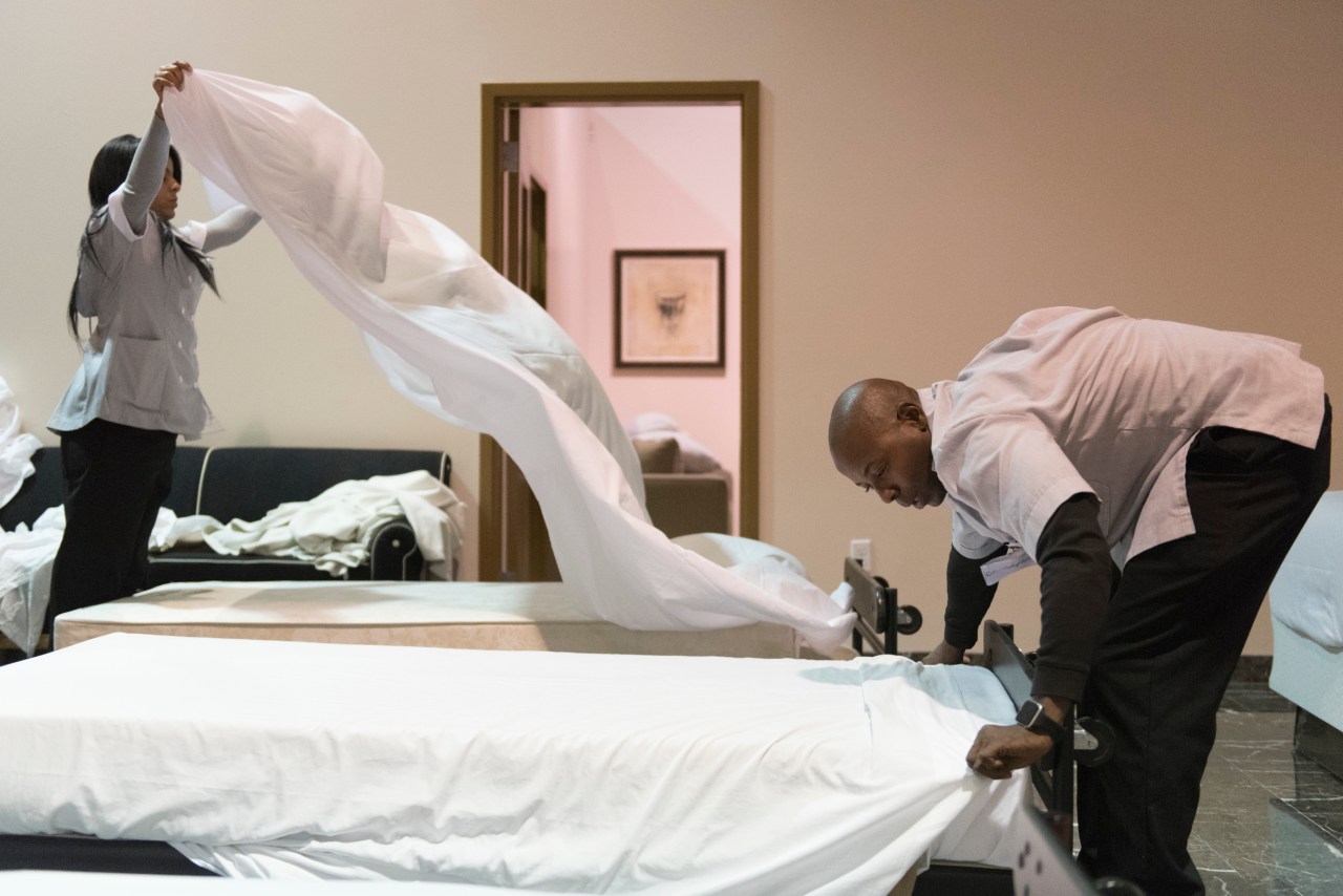 Students make beds during the Guest Room Attendant class at the Culinary Academy of Las Vegas.