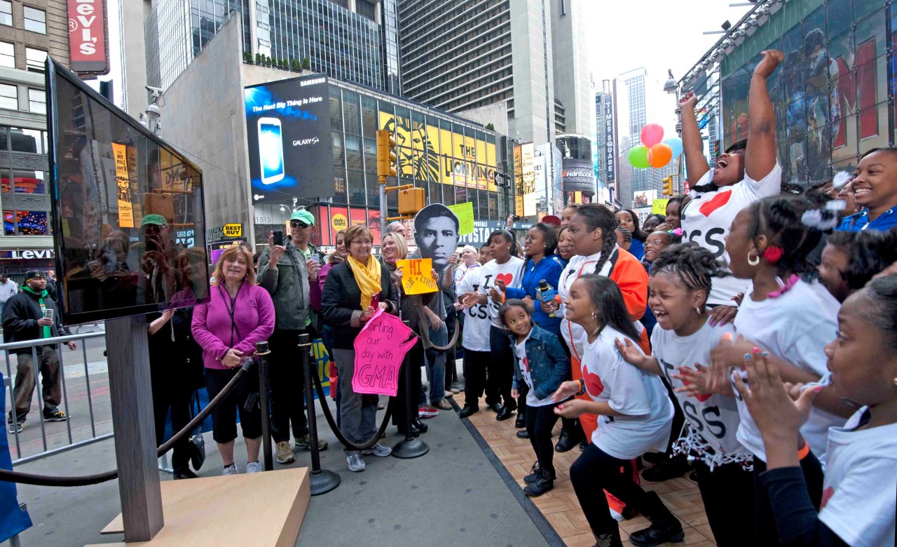 During a 2013 taping of Good Morning America in Times Square, the Camden Sophisticated Sisters watch as Beyonce delivers a televized message to them.