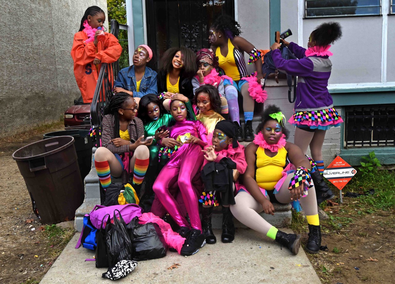 The Sophisticated Sisters relax on Tawanda Jones's doorstep in Camden before a performance.
