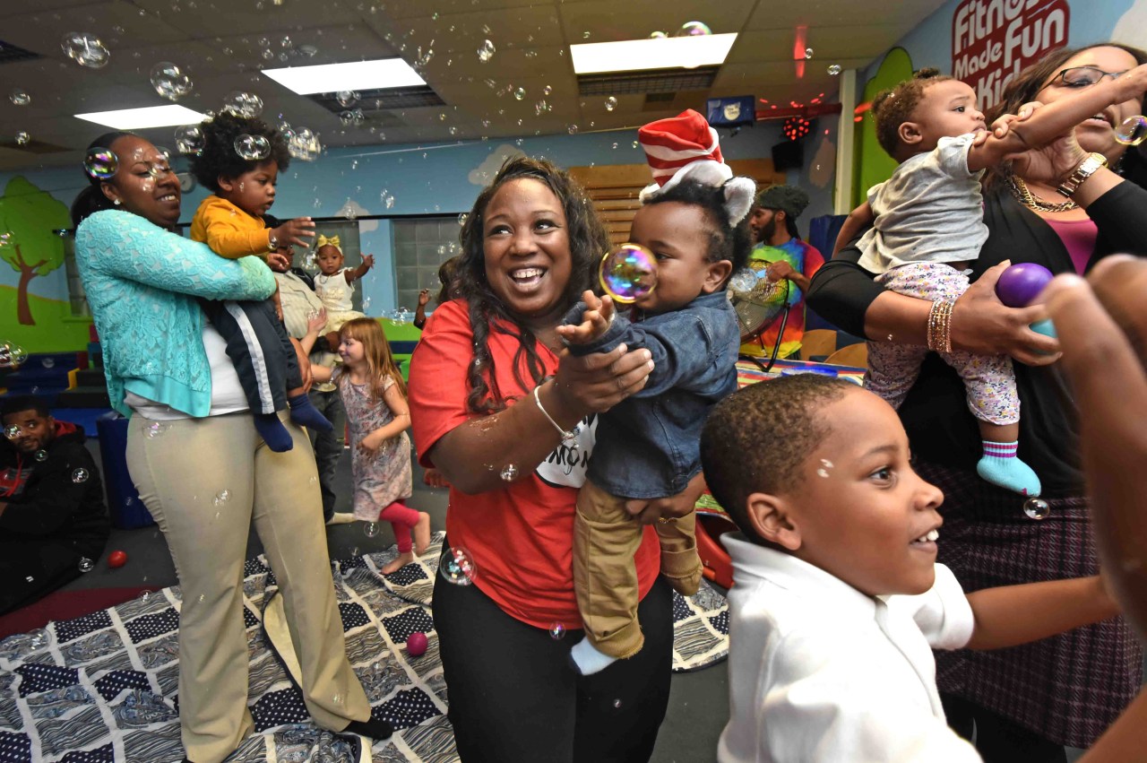 Tawanda Jones with the youngest of her four children, Re'Kye, at his first birthday party last year.