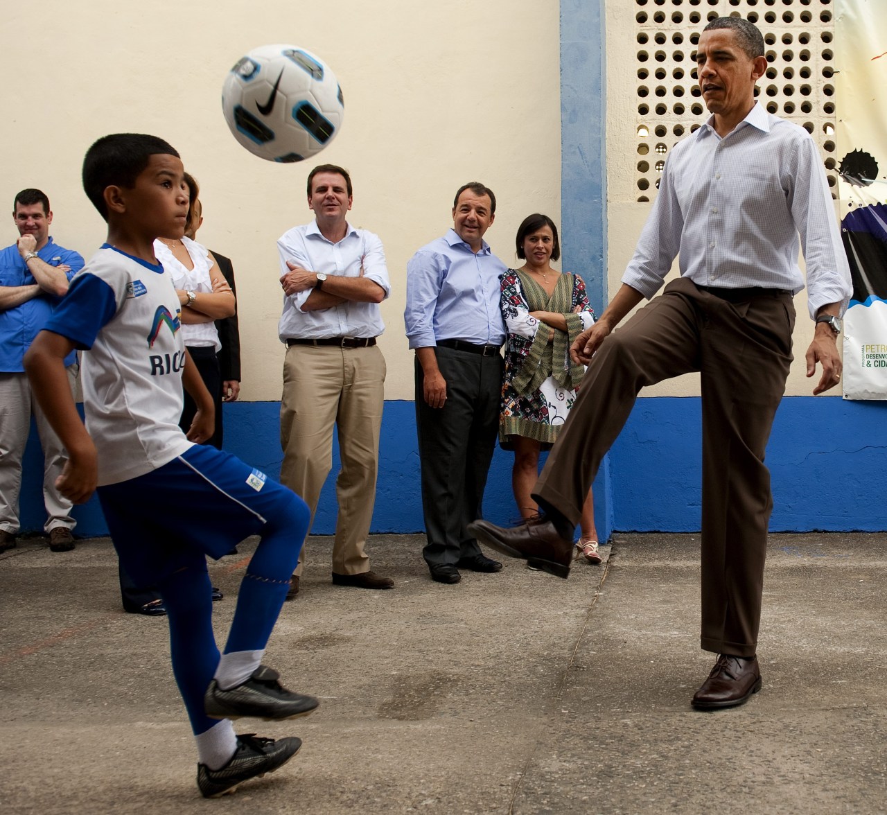 U.S. President Barack Obama plays soccer while visiting the "City of God" favela in Rio de Janiero, Brazil, on March 20, 2011. (Saul Loeb/Getty Images)