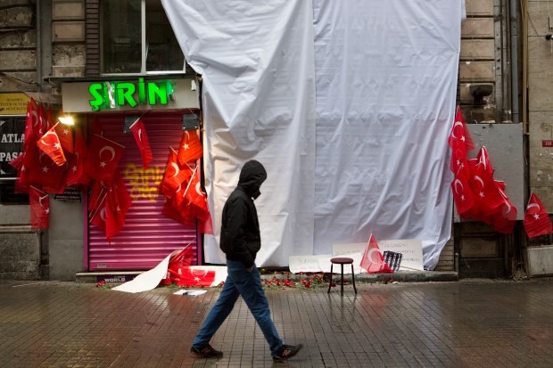 Flowers were left near the site of a suicide bombing on Istiklal street in central Istanbul that killed at least four people and wounded 36 others.