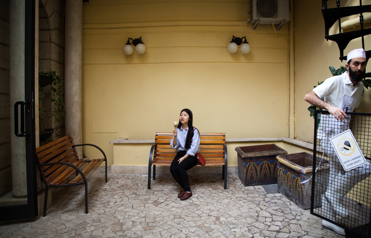 Lilia Meng eats a gelato in the yard of Fassi, a famous gelato store near Piazza Vittorio.