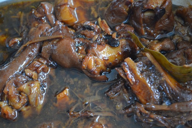 1. Chicken and pork adobo. / 2. Fried longganisa sausage with tambakol fish and tomato.