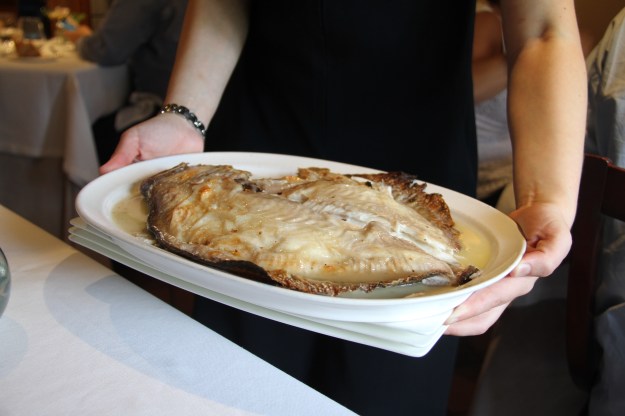 1. Turbot, or rodaballo, waiting to be grilled. (Photo by Mike Magers) / 2. And after the grill. (Photo by Matt Goulding)