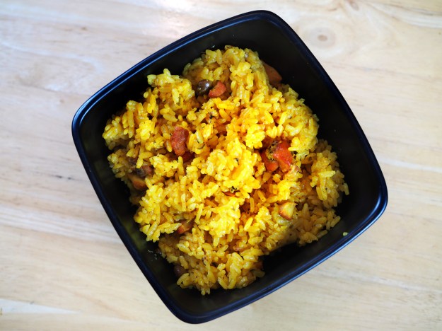 1. The tamale-like pasteles are a local favorite. / 2. Annatto-colored gandule rice.