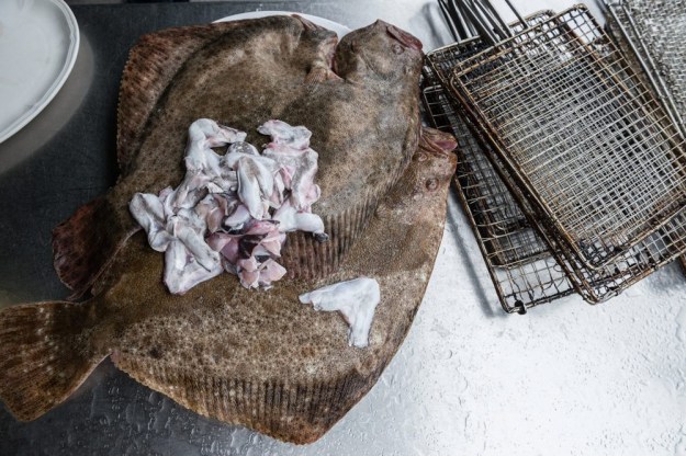 1. Turbot, or rodaballo, waiting to be grilled. (Photo by Mike Magers) / 2. And after the grill. (Photo by Matt Goulding)