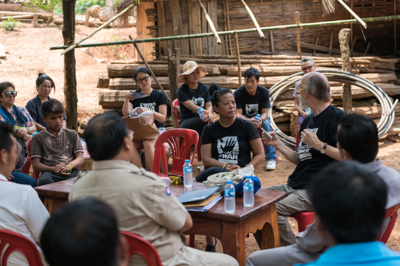 Channapha Khamvongsa with a delegation from Legacies of War during a visit to the village.