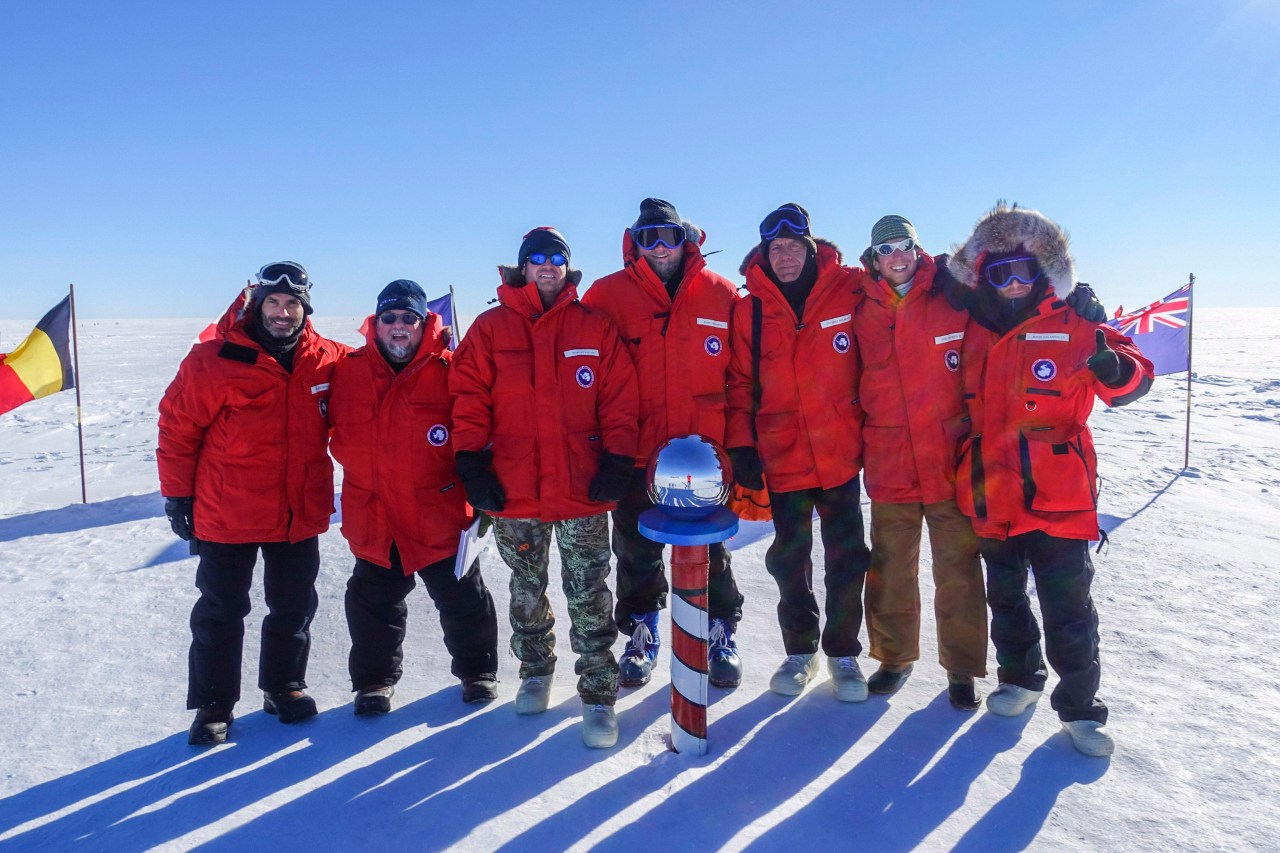 Crew photo at the ceremonial South Pole.