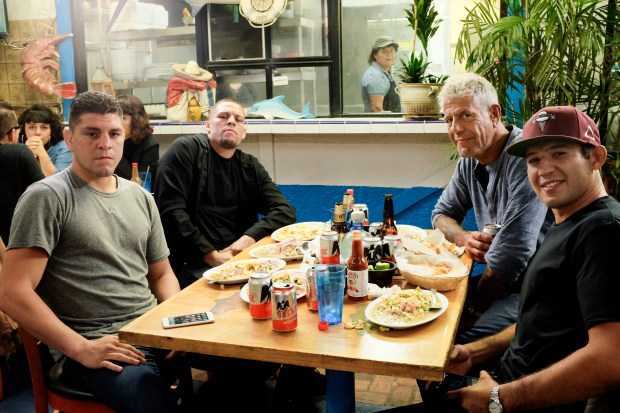 Bourdain with Nick and Nate Diaz, and Gilbert Melendez at Mariscos Chente.