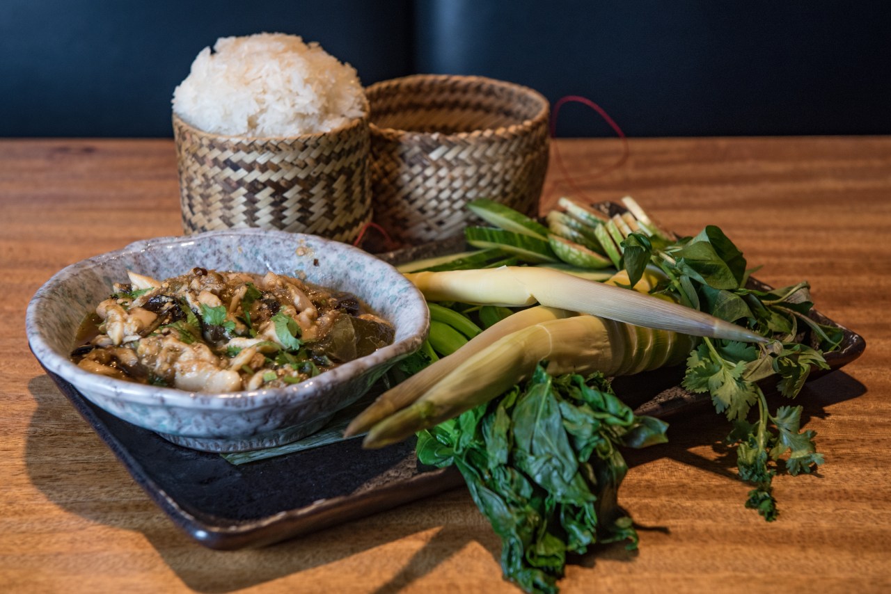 Poached bass served with sticky rice and wild young bamboo.