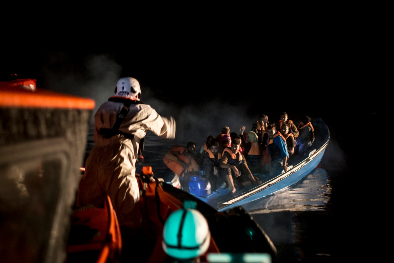 The Topaz approaches a boat during a rescue operation.