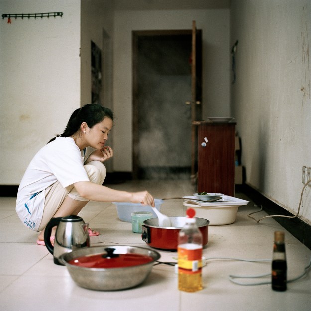 1. Most businesses in the city were run by merchants from China who have left. / 2. Jia Jia, a 25 year Laotian from the Luang Namtha Province, lives in one of the workers' quarters with her Chinese boyfriend.