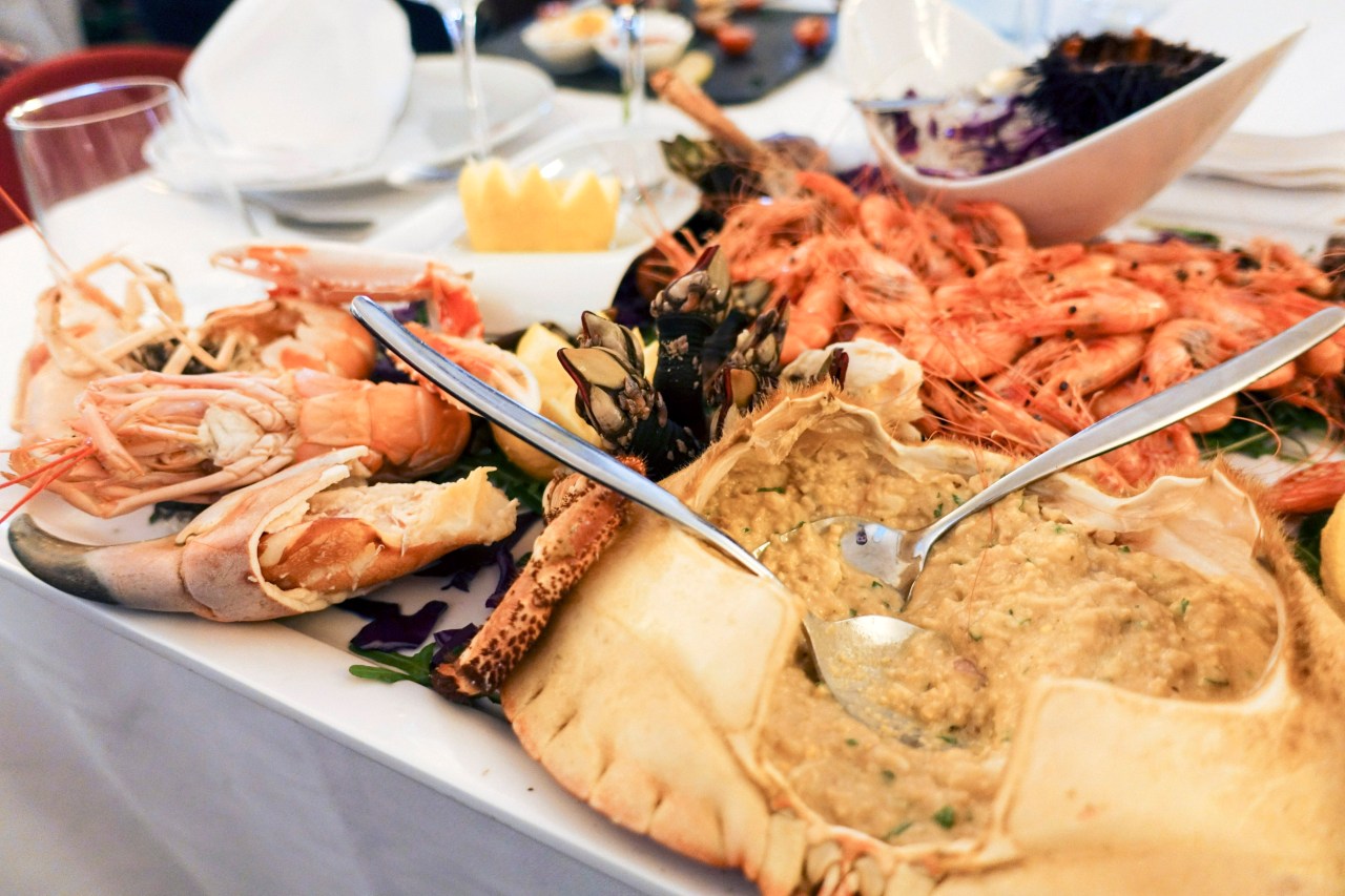 Crab dip, langoustines, and gooseneck barnacles at Esplanada Marisqueira A Antiga.