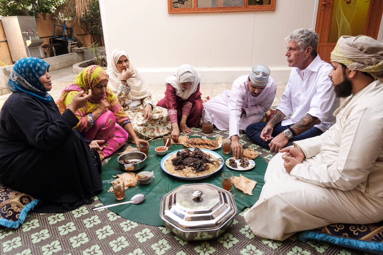 Bourdain joins Zahara as-Awfi and her family for a meal at their home in Al Hamra.