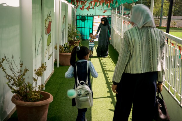 Dr. Zainab Alblushi, the first woman to become a pediatric surgeon in Oman, with her daughters.