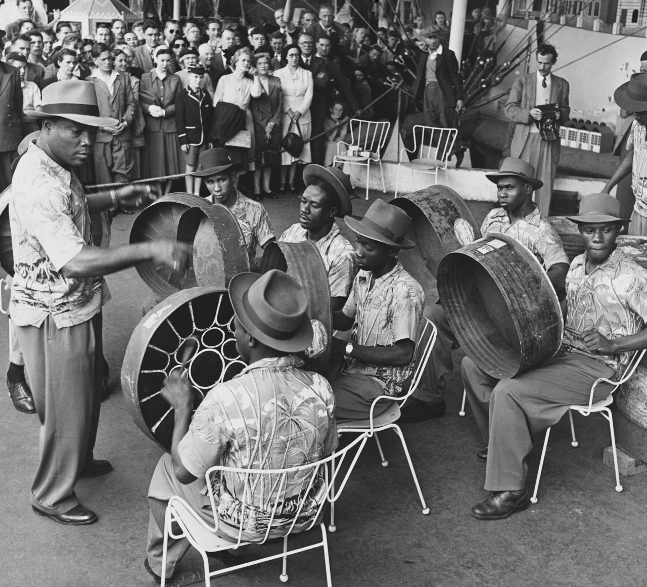 The Trinidad All Steel Percussion Orchestra, gives its first public performance in London at the South Bank under the leadership of their Manager, Joseph Griffith, a Lieutenant in the St. Lucia Police. (Photo by © Hulton-Deutsch Collection/CORBIS/Corbis via Getty Images)