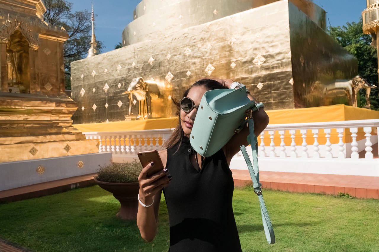 Dream stops by a Buddhist temple on her way to work.