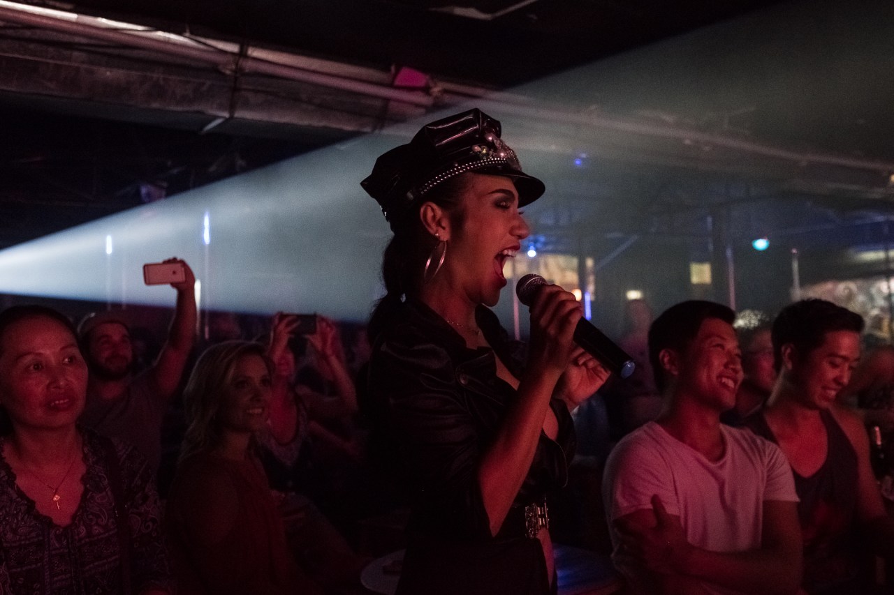 A performer announces the start of the show.