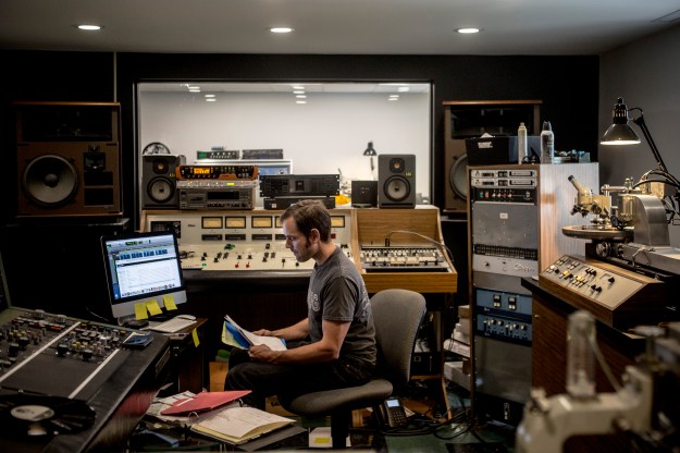 1. Wes Garland, an engineer at Nashville Record Productions, works in the mastering studio. / 2. Joe Bennett, an employee of more than 40 years, works at his record press.
