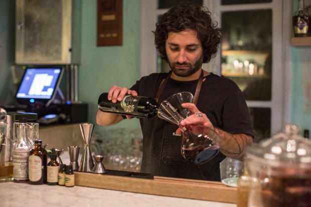 Wine writer Ziad Abi Akar opens a red wine that was made at The Couvent Rouge winery.