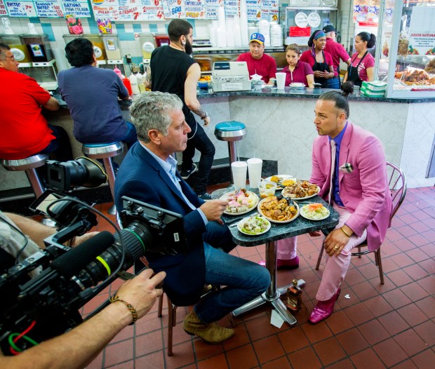 Bourdain with Justin Fornal, aka Baron Ambrosia, at Cuchifritos.