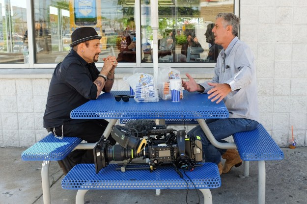 1: (L to R) Anthony Bourdain with Grandmaster Melle Mel. / 2: Handsome Dick Manitoba and Anthony Bourdain eating outside White Castle.