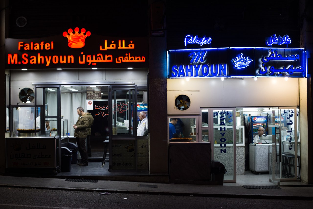 The original Sahyoun’s falafel, right, is now run by Zouhair Sahyoun. He no longer speaks to his brother Fouad, who runs the red Falafel M. Sahyoun on the left.