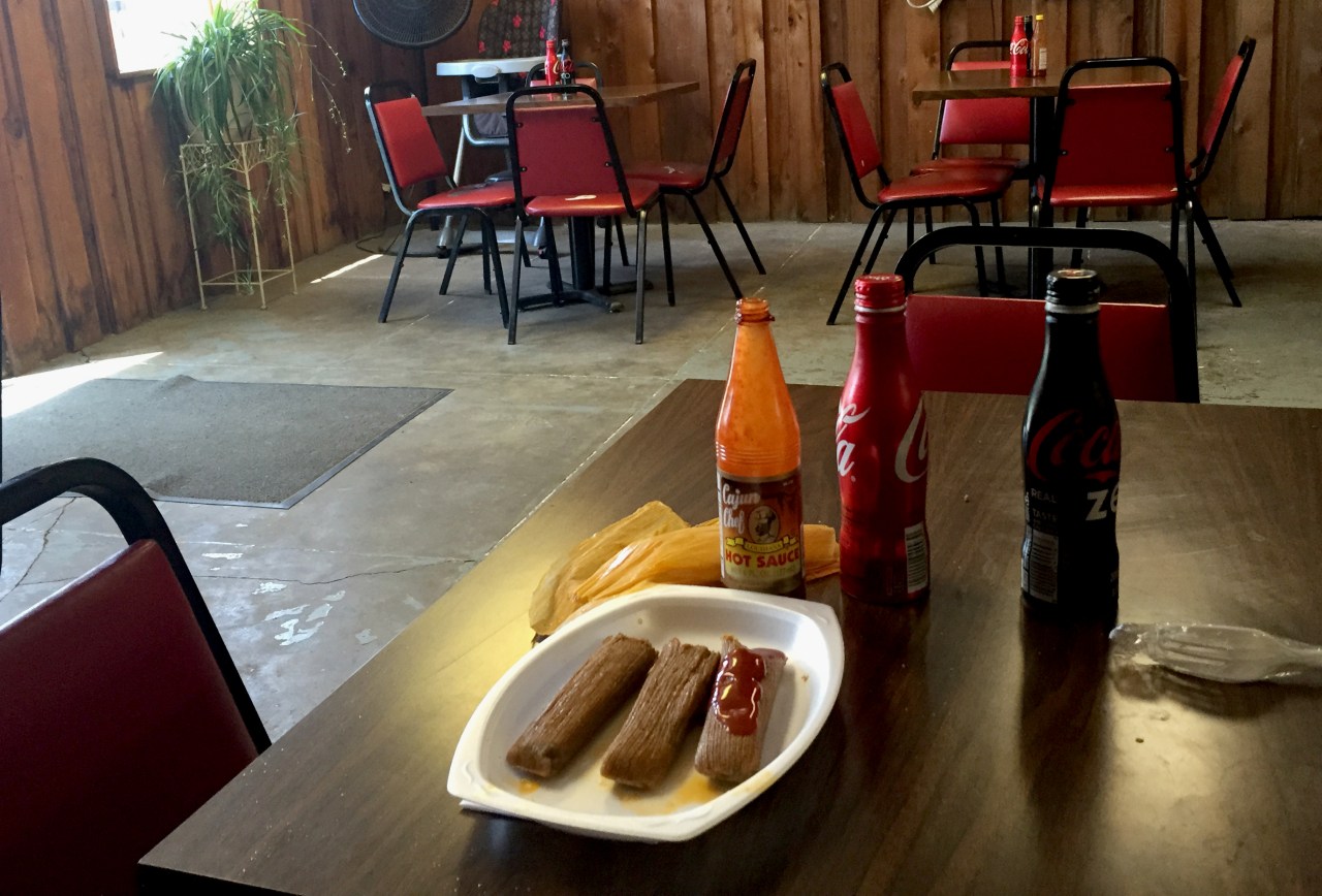 A plate of tamales served with Cajun Chef hot sauce inside Solly’s in Vicksburg.