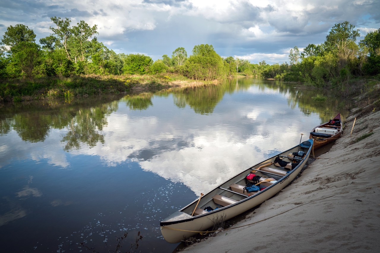 Canoes, unloaded for the evening, rest in a backchannel near Rosedale, Mississippi.