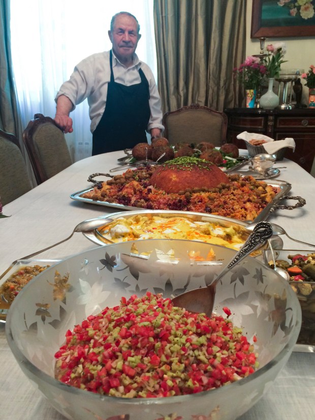 Nazila Noebashari's cook, Rahim, with the beautiful feast he created. (Photo by Erik Osterholm)