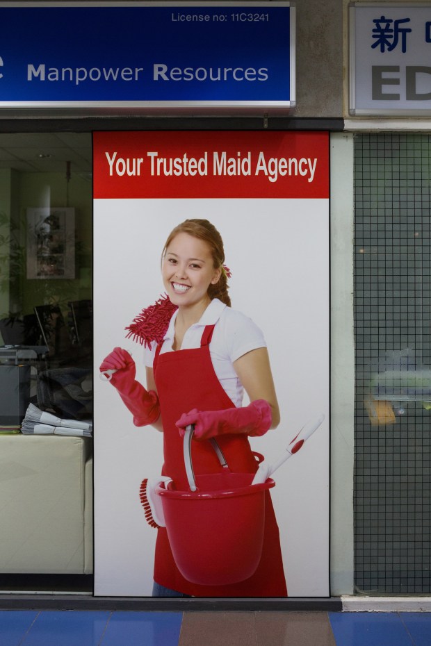 A maid agency advertises on their store front at Bukit Timah shopping centre in Singapore.