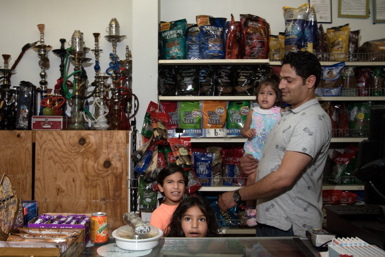Hamad Abdelrahman with his children at one of the two islamic grocery stores in Murfreesboro.