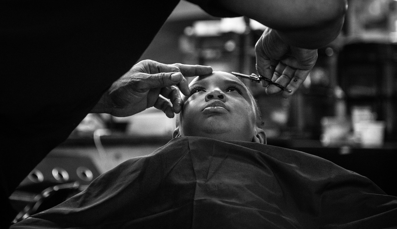 Noah Smith holds still as he receives a haircut at Dave's Barber Shop.