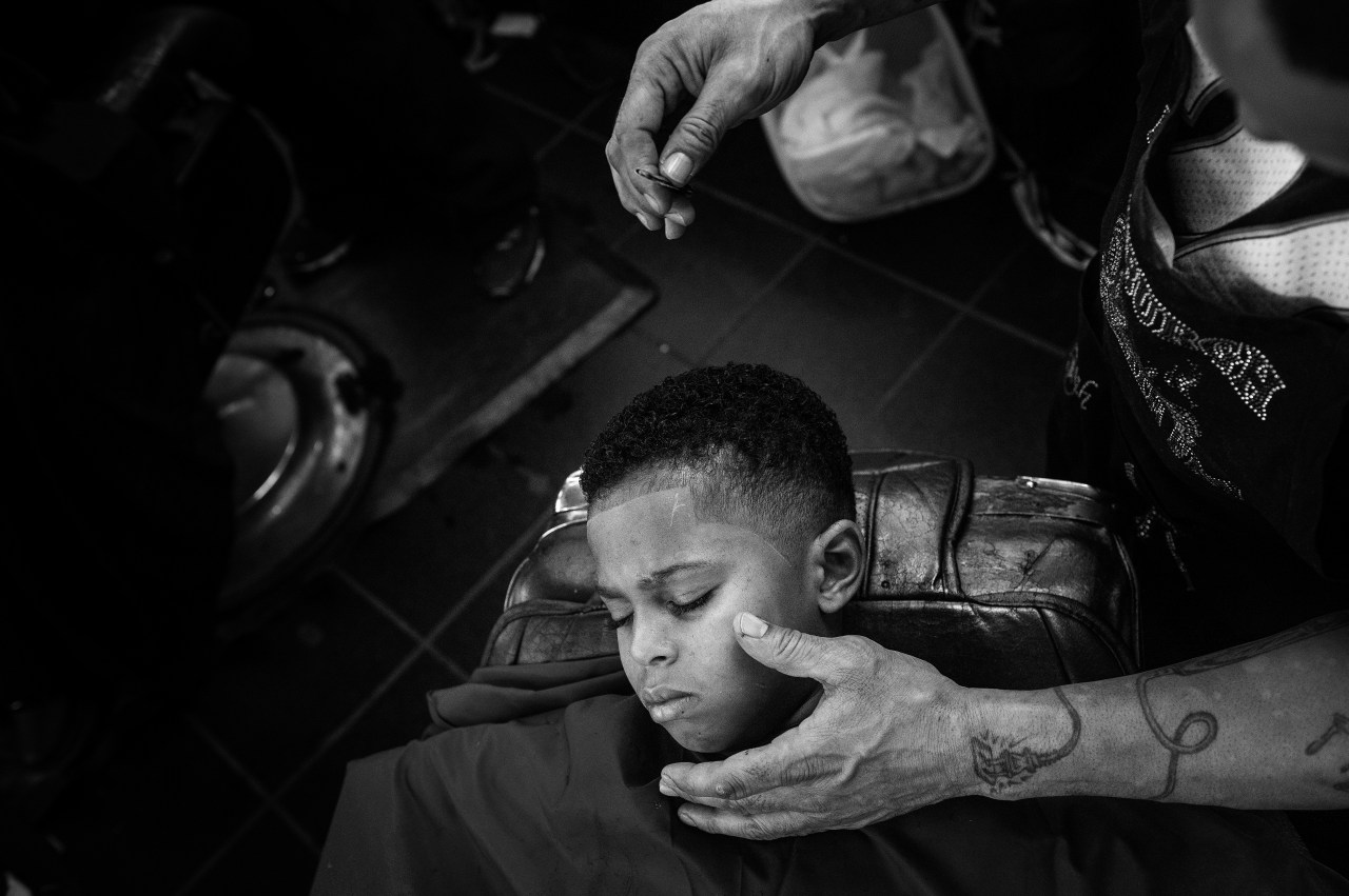 A young customer at Dave's Barber Shop.