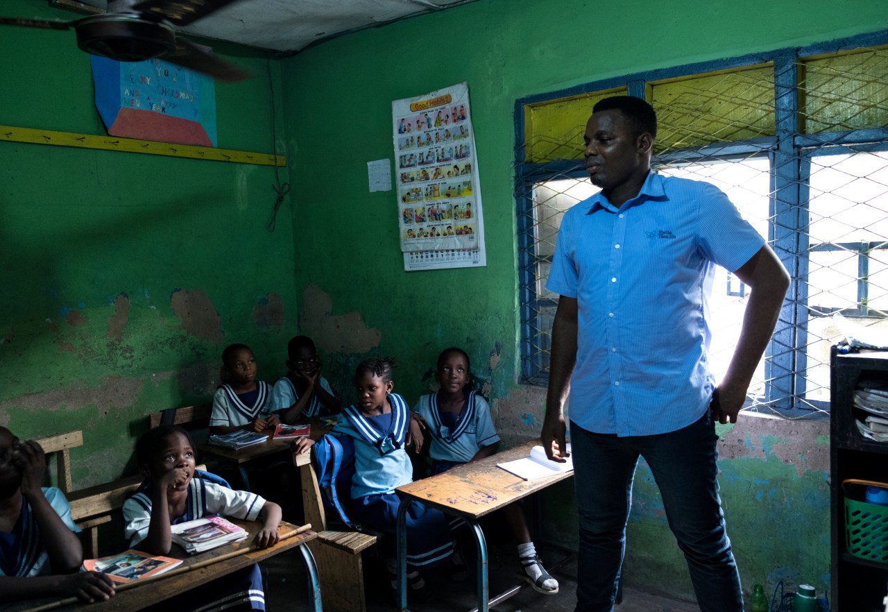 Eric Obuh gives a speech in a classroom in Lagos.