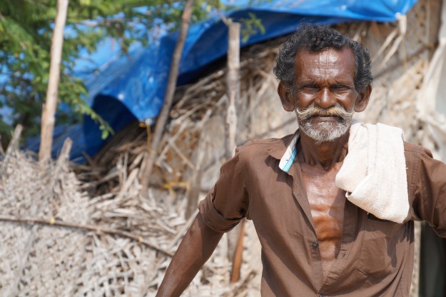 1. Anthony was born across the Strait in Sri Lanka but has lived in Rameswaram since 1974. Several days a week, he'll leave the harbor at 1 p.m. in his country boat, go nine miles out to sea, stopping just short of the international boundary, and return the following morning. / 2. The office of a seafood distributor just behind the jetty in Rameswaram.