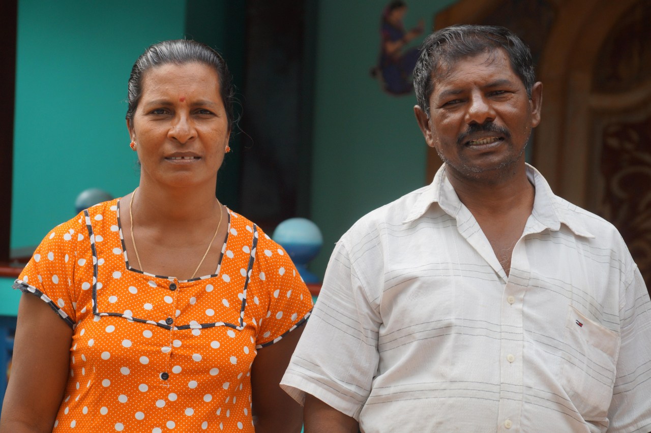 Stephen Croos and his wife Mariyarani in front of their new home in Pesalai.