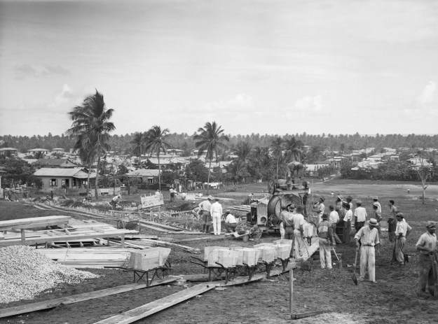 1. Multiple-dwelling public housing units like this modern group are found in the outskirts of the cities and towns. / 2. A 12-acre tract near San Juan when construction was beginning on houses for 131 families as part of a works relief and slum clearance project, the first public housing in Puerto Rico. (Both photos by Bettmann via Getty Images)