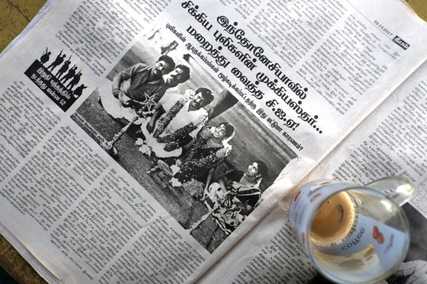 A newspaper shows Prabhakaran at his wedding.