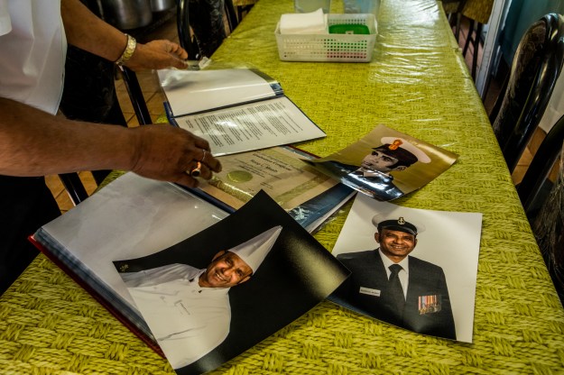 1. Rooplal Masih shows off portraits from his past. / 2. The couple in their restaurant.