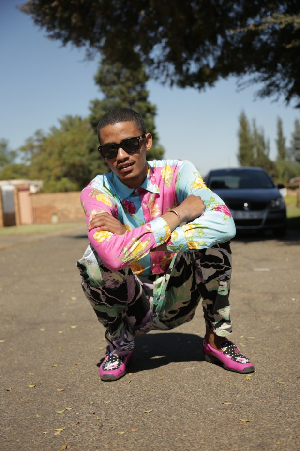 Tolouse poses outside of his mother’s home in El Dorado park in a Rossi Moda shirt costing 2,300 rand.