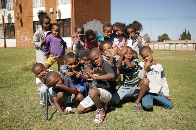 1. The skhothanes are proud to show off the media coverage their lifestyle has attracted. Lead member Tshepo remarks: “If I hadn’t come here [to Soweto], I wouldn’t be in magazines.” / 2. The children of El Dorado Park are quick to mimic The Commandos posing and "skhoting."