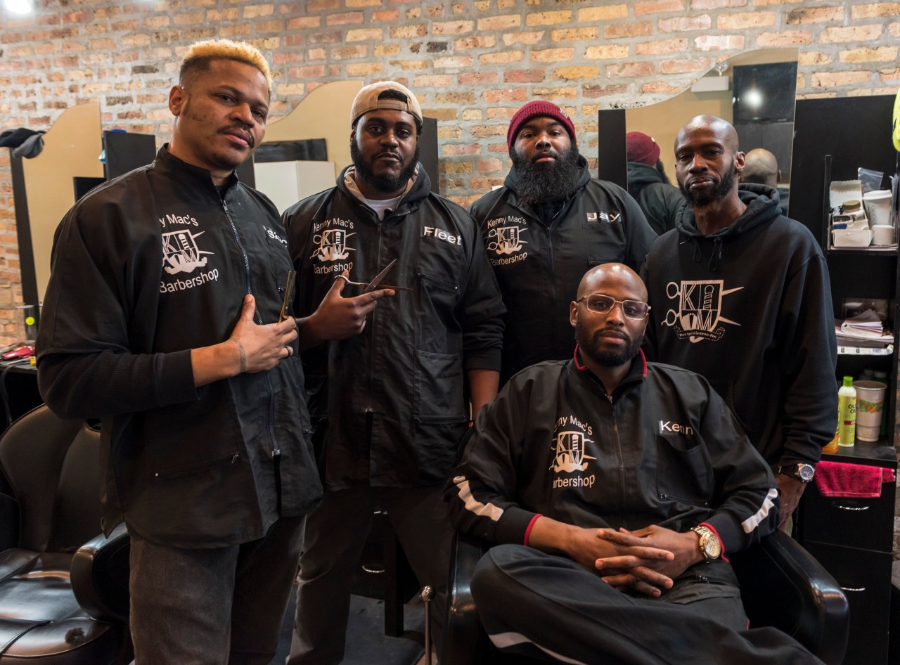 From left to right: Isaac Haygood, Fleetwood Wynton, Jay Johnson, Sean Gee, and seated in the chair is Kenny Mac, the owner of the shop.