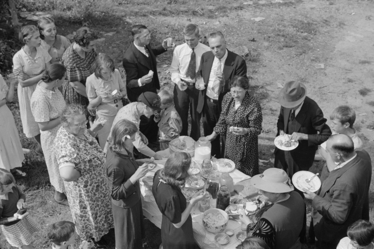 Residents of Jere eat at a Sunday school picnic brought to their town by neighboring parishes, September 1938. Photo by Marion Post Wolcott.
