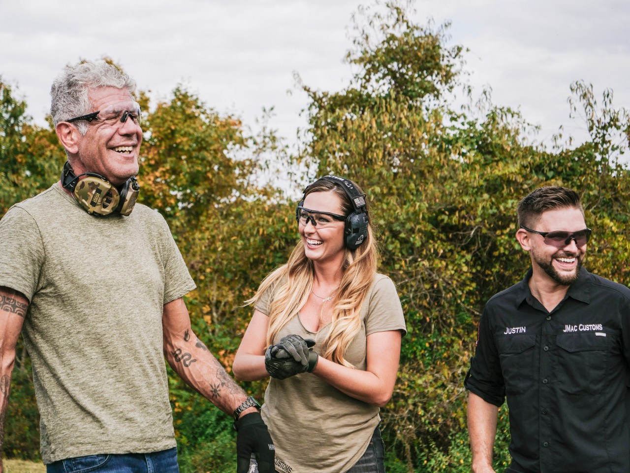 Bourdain shooting guns in West Virginia. Photo by David Scott Holloway.