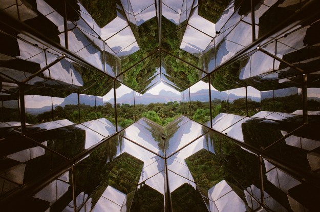 Photo 1: Visitors take turns operating “Viewing Machine” by Icelandic-Danish artist Olafur Eliasson. Photo 2: A glimpse of the regional landscape through Olafur Eliasson’s “Viewing Machine.”